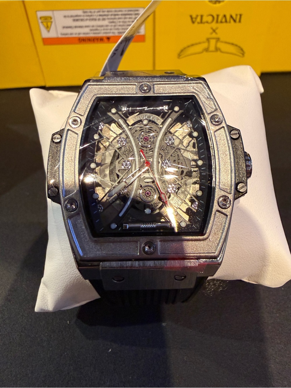 Invicta Silver Case Black Strap Skeleton Dial Watch with Red Accents